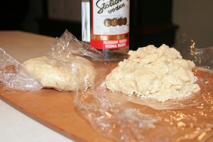 Processed pie dough on plastic wrap